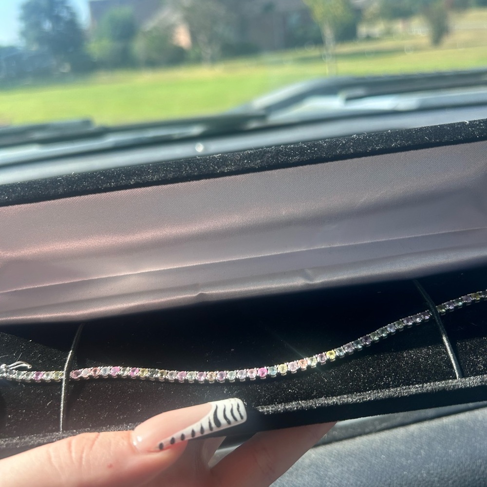 Unique 14k white gold tennis bracelet with emeralds